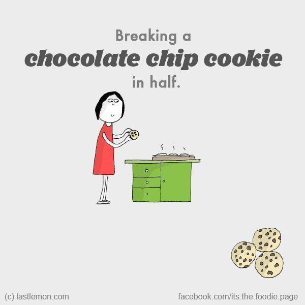 Foodie: Breaking a chocolate chip cookie in half.